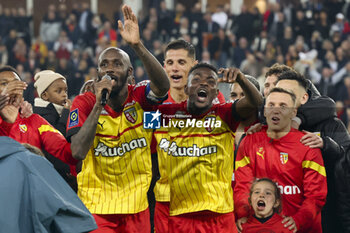 2023-05-12 - Captain Seko Fofana of Lens holding the mic, Salis Abdul Samed, Przemyslaw Frankowski and teammates celebrate the victory following the French championship Ligue 1 football match between RC Lens and Stade de Reims on May 12, 2023 at Stade Bollaert-Delelis in Lens, France - FOOTBALL - FRENCH CHAMP - LENS V REIMS - FRENCH LIGUE 1 - SOCCER