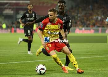 2023-05-12 - Przemyslaw Frankowski of Lens, Folarin Balogun of Reims during the French championship Ligue 1 football match between RC Lens and Stade de Reims on May 12, 2023 at Stade Bollaert-Delelis in Lens, France - FOOTBALL - FRENCH CHAMP - LENS V REIMS - FRENCH LIGUE 1 - SOCCER