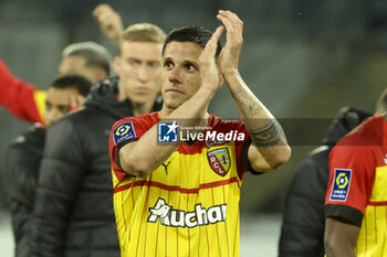 2023-05-12 - Florian Sotoca of Lens celebrates the victory following the French championship Ligue 1 football match between RC Lens and Stade de Reims on May 12, 2023 at Stade Bollaert-Delelis in Lens, France - FOOTBALL - FRENCH CHAMP - LENS V REIMS - FRENCH LIGUE 1 - SOCCER