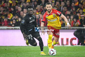 2023-05-12 - Folarin BALOGUN of Reims and Jonathan GRADIT of Lens during the French championship Ligue 1 football match between RC Lens and Stade de Reims on May 12, 2023 at Bollaert-Delelis stadium in Lens, France - FOOTBALL - FRENCH CHAMP - LENS V REIMS - FRENCH LIGUE 1 - SOCCER