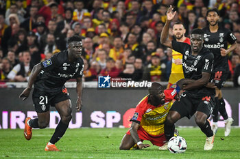 2023-05-12 - Azor MATUSIWA of Reims, David PEREIRA DA COSTA of Lens and Marshall MUNETSI of Reims during the French championship Ligue 1 football match between RC Lens and Stade de Reims on May 12, 2023 at Bollaert-Delelis stadium in Lens, France - FOOTBALL - FRENCH CHAMP - LENS V REIMS - FRENCH LIGUE 1 - SOCCER
