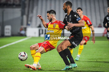 2023-05-12 - Adrien THOMASSON of Lens and Yunis ABDELHAMID of Reims during the French championship Ligue 1 football match between RC Lens and Stade de Reims on May 12, 2023 at Bollaert-Delelis stadium in Lens, France - FOOTBALL - FRENCH CHAMP - LENS V REIMS - FRENCH LIGUE 1 - SOCCER