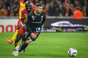 2023-05-12 - Seko FOFANA of Lens and Arber ZENELI of Reims during the French championship Ligue 1 football match between RC Lens and Stade de Reims on May 12, 2023 at Bollaert-Delelis stadium in Lens, France - FOOTBALL - FRENCH CHAMP - LENS V REIMS - FRENCH LIGUE 1 - SOCCER