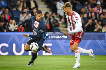 2023-05-13 - Kylian MBAPPE of PSG and Clement VIDAL of Ajaccio during the French championship Ligue 1 football match between Paris Saint-Germain and AC Ajaccio on May 13, 2023 at Parc des Princes stadium in Paris, France - FOOTBALL - FRENCH CHAMP - PARIS SG V AJACCIO - FRENCH LIGUE 1 - SOCCER