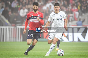 2023-05-20 - Andre GOMES of Lille and Ruslan MALINOVSKYI of Marseille during the French championship Ligue 1 football match between Losc Lille and Olympique de Marseille on May 20, 2023 at Pierre Mauroy stadium in Villeneuve-d'Ascq near Lille, France - FOOTBALL - FRENCH CHAMP - LILLE V MARSEILLE - FRENCH LIGUE 1 - SOCCER