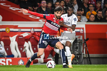 2023-05-20 - Andre GOMES of Lille and Issa KABORE of Marseille during the French championship Ligue 1 football match between Losc Lille and Olympique de Marseille on May 20, 2023 at Pierre Mauroy stadium in Villeneuve-d'Ascq near Lille, France - FOOTBALL - FRENCH CHAMP - LILLE V MARSEILLE - FRENCH LIGUE 1 - SOCCER