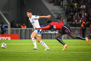 2023-05-20 - Ruslan MALINOVSKYI of Marseille and Mohamed BAYO of Lille during the French championship Ligue 1 football match between Losc Lille and Olympique de Marseille on May 20, 2023 at Pierre Mauroy stadium in Villeneuve-d'Ascq near Lille, France - FOOTBALL - FRENCH CHAMP - LILLE V MARSEILLE - FRENCH LIGUE 1 - SOCCER