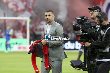 2023-05-20 - Former player of Lille Burak Yilmaz kicks off the French championship Ligue 1 Uber Eats football match between Lille OSC (LOSC) and Olympique de Marseille (OM) on May 20, 2023 at Stade Pierre Mauroy in Villeneuve-d'Ascq near Lille, France - FOOTBALL - FRENCH CHAMP - LILLE V MARSEILLE - FRENCH LIGUE 1 - SOCCER