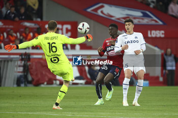 2023-05-20 - Marseille goalkeeper Pau Lopez, Carlos Baleba of Lille, Leonardo Balerdi of Marseille during the French championship Ligue 1 Uber Eats football match between Lille OSC (LOSC) and Olympique de Marseille (OM) on May 20, 2023 at Stade Pierre Mauroy in Villeneuve-d'Ascq near Lille, France - FOOTBALL - FRENCH CHAMP - LILLE V MARSEILLE - FRENCH LIGUE 1 - SOCCER
