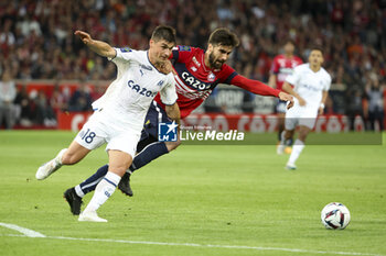2023-05-20 - Ruslan Malinovskyi of Marseille, Andre Gomes of Lille during the French championship Ligue 1 Uber Eats football match between Lille OSC (LOSC) and Olympique de Marseille (OM) on May 20, 2023 at Stade Pierre Mauroy in Villeneuve-d'Ascq near Lille, France - FOOTBALL - FRENCH CHAMP - LILLE V MARSEILLE - FRENCH LIGUE 1 - SOCCER