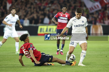 2023-05-20 - Ruslan Malinovskyi of Marseille, left Leny Yoro of Lille during the French championship Ligue 1 Uber Eats football match between Lille OSC (LOSC) and Olympique de Marseille (OM) on May 20, 2023 at Stade Pierre Mauroy in Villeneuve-d'Ascq near Lille, France - FOOTBALL - FRENCH CHAMP - LILLE V MARSEILLE - FRENCH LIGUE 1 - SOCCER
