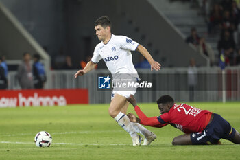 2023-05-20 - Ruslan Malinovskyi of Marseille, Mohamed Bayo of Lille during the French championship Ligue 1 Uber Eats football match between Lille OSC (LOSC) and Olympique de Marseille (OM) on May 20, 2023 at Stade Pierre Mauroy in Villeneuve-d'Ascq near Lille, France - FOOTBALL - FRENCH CHAMP - LILLE V MARSEILLE - FRENCH LIGUE 1 - SOCCER