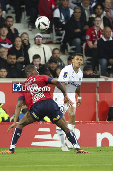 2023-05-20 - Alexis Sanchez of Marseille, left Bafode Diakite of Lille during the French championship Ligue 1 Uber Eats football match between Lille OSC (LOSC) and Olympique de Marseille (OM) on May 20, 2023 at Stade Pierre Mauroy in Villeneuve-d'Ascq near Lille, France - FOOTBALL - FRENCH CHAMP - LILLE V MARSEILLE - FRENCH LIGUE 1 - SOCCER