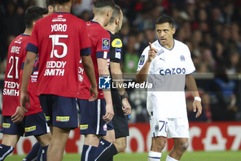 2023-05-20 - Alexis Sanchez of Marseille talks to Referee Jerome Brisard (left) during the French championship Ligue 1 Uber Eats football match between Lille OSC (LOSC) and Olympique de Marseille (OM) on May 20, 2023 at Stade Pierre Mauroy in Villeneuve-d'Ascq near Lille, France - FOOTBALL - FRENCH CHAMP - LILLE V MARSEILLE - FRENCH LIGUE 1 - SOCCER