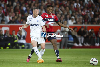 2023-05-20 - Jordan Veretout of Marseille, Jonathan David of Lille during the French championship Ligue 1 Uber Eats football match between Lille OSC (LOSC) and Olympique de Marseille (OM) on May 20, 2023 at Stade Pierre Mauroy in Villeneuve-d'Ascq near Lille, France - FOOTBALL - FRENCH CHAMP - LILLE V MARSEILLE - FRENCH LIGUE 1 - SOCCER