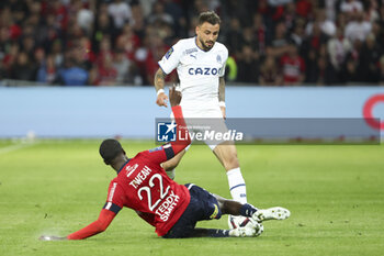2023-05-20 - Jonathan Clauss of Marseille, Timothy Weah of Lille during the French championship Ligue 1 Uber Eats football match between Lille OSC (LOSC) and Olympique de Marseille (OM) on May 20, 2023 at Stade Pierre Mauroy in Villeneuve-d'Ascq near Lille, France - FOOTBALL - FRENCH CHAMP - LILLE V MARSEILLE - FRENCH LIGUE 1 - SOCCER