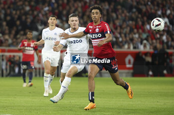 2023-05-20 - Vitinha aka Vitor Oliveira of Marseille, Leny Yoro of Lille during the French championship Ligue 1 Uber Eats football match between Lille OSC (LOSC) and Olympique de Marseille (OM) on May 20, 2023 at Stade Pierre Mauroy in Villeneuve-d'Ascq near Lille, France - FOOTBALL - FRENCH CHAMP - LILLE V MARSEILLE - FRENCH LIGUE 1 - SOCCER