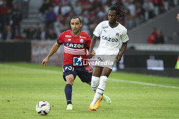 2023-05-20 - Ismaily Goncalves Santos of Lille, Issa Kabore of Marseille during the French championship Ligue 1 Uber Eats football match between Lille OSC (LOSC) and Olympique de Marseille (OM) on May 20, 2023 at Stade Pierre Mauroy in Villeneuve-d'Ascq near Lille, France - FOOTBALL - FRENCH CHAMP - LILLE V MARSEILLE - FRENCH LIGUE 1 - SOCCER