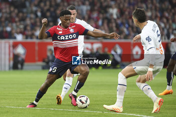 2023-05-20 - Jonathan David of Lille, Jordan Veretout of Marseille during the French championship Ligue 1 Uber Eats football match between Lille OSC (LOSC) and Olympique de Marseille (OM) on May 20, 2023 at Stade Pierre Mauroy in Villeneuve-d'Ascq near Lille, France - FOOTBALL - FRENCH CHAMP - LILLE V MARSEILLE - FRENCH LIGUE 1 - SOCCER