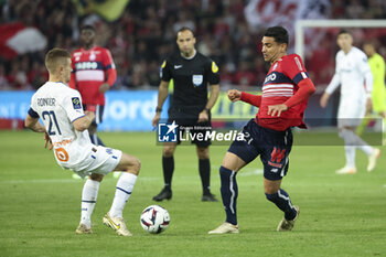 2023-05-20 - Benjamin Andre of Lille, left Valentin Rongier of Marseille during the French championship Ligue 1 Uber Eats football match between Lille OSC (LOSC) and Olympique de Marseille (OM) on May 20, 2023 at Stade Pierre Mauroy in Villeneuve-d'Ascq near Lille, France - FOOTBALL - FRENCH CHAMP - LILLE V MARSEILLE - FRENCH LIGUE 1 - SOCCER