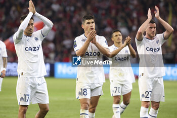 2023-05-20 - Cengiz Under, Ruslan Malinovskyi, Jordan Veretout of Marseille salute the supporters following the French championship Ligue 1 Uber Eats football match between Lille OSC (LOSC) and Olympique de Marseille (OM) on May 20, 2023 at Stade Pierre Mauroy in Villeneuve-d'Ascq near Lille, France - FOOTBALL - FRENCH CHAMP - LILLE V MARSEILLE - FRENCH LIGUE 1 - SOCCER