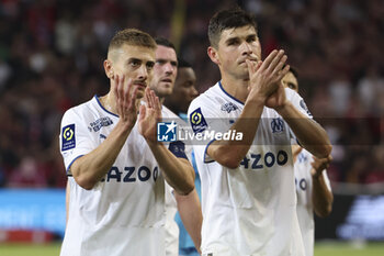 2023-05-20 - Valentin Rongier, Ruslan Malinovskyi of Marseille salute the supporters following the French championship Ligue 1 Uber Eats football match between Lille OSC (LOSC) and Olympique de Marseille (OM) on May 20, 2023 at Stade Pierre Mauroy in Villeneuve-d'Ascq near Lille, France - FOOTBALL - FRENCH CHAMP - LILLE V MARSEILLE - FRENCH LIGUE 1 - SOCCER