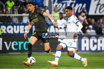 2023-05-21 - Hugo EKITIKE of PSG and Rayan RAVELOSON of Auxerre during the French championship Ligue 1 football match between AJ Auxerre and Paris Saint-Germain on May 21, 2023 at Abbe-Deschamps stadium in Auxerre, France - FOOTBALL - FRENCH CHAMP - AUXERRE V PARIS SG - FRENCH LIGUE 1 - SOCCER