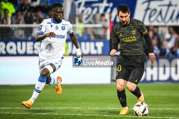 2023-05-21 - Gideon MENSAH of Auxerre and Lionel (Leo) MESSI of PSG during the French championship Ligue 1 football match between AJ Auxerre and Paris Saint-Germain on May 21, 2023 at Abbe-Deschamps stadium in Auxerre, France - FOOTBALL - FRENCH CHAMP - AUXERRE V PARIS SG - FRENCH LIGUE 1 - SOCCER