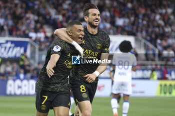 2023-05-21 - Kylian Mbappe of PSG celebrates his first goal with Fabian Ruiz Pena during the French championship Ligue 1 football match between AJ Auxerre and Paris Saint-Germain on May 21, 2023 at Abbé-Deschamps stadium in Auxerre, France - FOOTBALL - FRENCH CHAMP - AUXERRE V PARIS SG - FRENCH LIGUE 1 - SOCCER