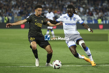 2023-05-21 - Warren Zaire-Emery of PSG, Gideon Mensah of Auxerre during the French championship Ligue 1 football match between AJ Auxerre (AJA) and Paris Saint-Germain (PSG) on May 21, 2023 at Abbé-Deschamps stadium in Auxerre, France - FOOTBALL - FRENCH CHAMP - AUXERRE V PARIS SG - FRENCH LIGUE 1 - SOCCER