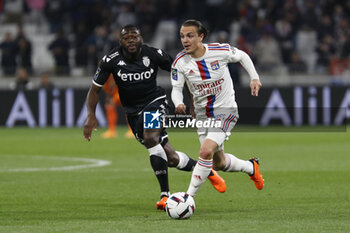 2023-05-19 - Maxence CAQUERET of Lyon and Youssouf FOFANA of Monaco during the French championship Ligue 1 football match between Olympique Lyonnais (Lyon) and AS Monaco on May 19, 2023 at Groupama Stadium in Decines-Charpieu near Lyon, France - FOOTBALL - FRENCH CHAMP - LYON V MONACO - FRENCH LIGUE 1 - SOCCER