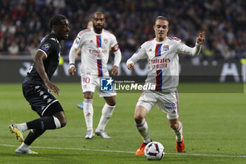2023-05-19 - Maxence CAQUERET of Lyon and Axel DISASI of Monaco during the French championship Ligue 1 football match between Olympique Lyonnais (Lyon) and AS Monaco on May 19, 2023 at Groupama Stadium in Decines-Charpieu near Lyon, France - FOOTBALL - FRENCH CHAMP - LYON V MONACO - FRENCH LIGUE 1 - SOCCER