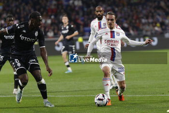 19/05/2023 - Maxence CAQUERET of Lyon and Axel DISASI of Monaco during the French championship Ligue 1 football match between Olympique Lyonnais (Lyon) and AS Monaco on May 19, 2023 at Groupama Stadium in Decines-Charpieu near Lyon, France - FOOTBALL - FRENCH CHAMP - LYON V MONACO - FRENCH LIGUE 1 - CALCIO
