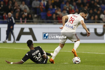 2023-05-19 - Rayan CHERKI of Lyon and Chrislain MATSIMA of Monaco during the French championship Ligue 1 football match between Olympique Lyonnais (Lyon) and AS Monaco on May 19, 2023 at Groupama Stadium in Decines-Charpieu near Lyon, France - FOOTBALL - FRENCH CHAMP - LYON V MONACO - FRENCH LIGUE 1 - SOCCER
