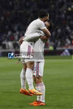 2023-05-19 - Maxence CAQUERET of Lyon celebrate a goal and Rayan CHERKI of Lyon during the French championship Ligue 1 football match between Olympique Lyonnais (Lyon) and AS Monaco on May 19, 2023 at Groupama Stadium in Decines-Charpieu near Lyon, France - FOOTBALL - FRENCH CHAMP - LYON V MONACO - FRENCH LIGUE 1 - SOCCER