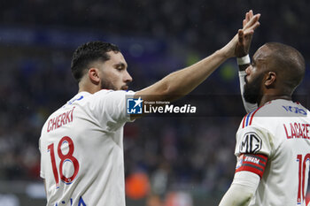 2023-05-19 - Rayan CHERKI of Lyon celebrate score a goal and Alexandre LACAZETTE of Lyon during the French championship Ligue 1 football match between Olympique Lyonnais (Lyon) and AS Monaco on May 19, 2023 at Groupama Stadium in Decines-Charpieu near Lyon, France - FOOTBALL - FRENCH CHAMP - LYON V MONACO - FRENCH LIGUE 1 - SOCCER