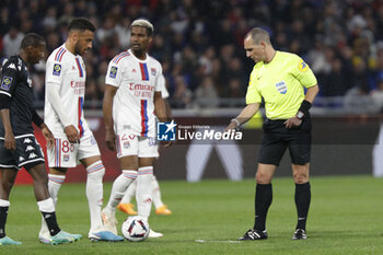 2023-05-19 - Referee Benoit MILLOT and Thiago MENDES of Lyon. And Corentin TOLISSO of Lyon during the French championship Ligue 1 football match between Olympique Lyonnais (Lyon) and AS Monaco on May 19, 2023 at Groupama Stadium in Decines-Charpieu near Lyon, France - FOOTBALL - FRENCH CHAMP - LYON V MONACO - FRENCH LIGUE 1 - SOCCER