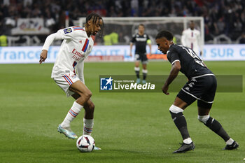 2023-05-19 - Bradley BARCOLA of Lyon and Ismail JAKOBS of Monaco during the French championship Ligue 1 football match between Olympique Lyonnais (Lyon) and AS Monaco on May 19, 2023 at Groupama Stadium in Decines-Charpieu near Lyon, France - FOOTBALL - FRENCH CHAMP - LYON V MONACO - FRENCH LIGUE 1 - SOCCER