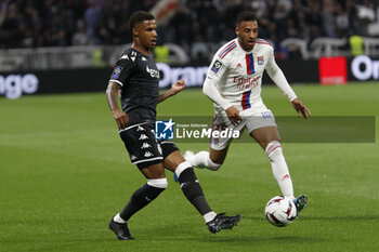 2023-05-19 - Ismail JAKOBS of Monaco and Corentin TOLISSO of Lyon during the French championship Ligue 1 football match between Olympique Lyonnais (Lyon) and AS Monaco on May 19, 2023 at Groupama Stadium in Decines-Charpieu near Lyon, France - FOOTBALL - FRENCH CHAMP - LYON V MONACO - FRENCH LIGUE 1 - SOCCER