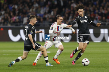 2023-05-19 - Maghnes AKLIOUCHE of Monaco and Maxence CAQUERET of Lyon and Aleksandr GOLOVIN of Monaco during the French championship Ligue 1 football match between Olympique Lyonnais (Lyon) and AS Monaco on May 19, 2023 at Groupama Stadium in Decines-Charpieu near Lyon, France - FOOTBALL - FRENCH CHAMP - LYON V MONACO - FRENCH LIGUE 1 - SOCCER