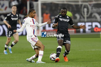 2023-05-19 - Bradley BARCOLA of Lyon and Youssouf FOFANA of Monaco during the French championship Ligue 1 football match between Olympique Lyonnais (Lyon) and AS Monaco on May 19, 2023 at Groupama Stadium in Decines-Charpieu near Lyon, France - FOOTBALL - FRENCH CHAMP - LYON V MONACO - FRENCH LIGUE 1 - SOCCER