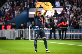 2023-06-03 - Kylian MBAPPE of PSG celebrates his goal with Sergio Rico's jersey during the French championship Ligue 1 football match between Paris Saint-Germain and Clermont Foot 63 on June 3, 2023 at Parc des Princes stadium in Paris, France - FOOTBALL - FRENCH CHAMP - PARIS SG V CLERMONT - FRENCH LIGUE 1 - SOCCER