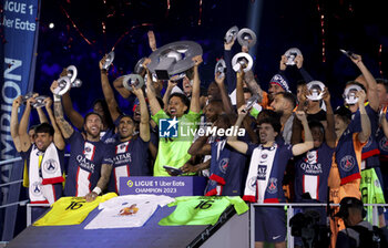 2023-06-03 - Marquinhos of PSG and teammates celebrate during the trophy ceremony following the French championship Ligue 1 football match between Paris Saint-Germain (PSG) and Clermont Foot 63 on June 3, 2023 at Parc des Princes stadium in Paris, France - FOOTBALL - FRENCH CHAMP - PARIS SG V CLERMONT - FRENCH LIGUE 1 - SOCCER