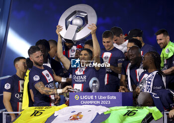 2023-06-03 - Achraf Hakimi of PSG and teammates celebrate during the trophy ceremony following the French championship Ligue 1 football match between Paris Saint-Germain (PSG) and Clermont Foot 63 on June 3, 2023 at Parc des Princes stadium in Paris, France - FOOTBALL - FRENCH CHAMP - PARIS SG V CLERMONT - FRENCH LIGUE 1 - SOCCER