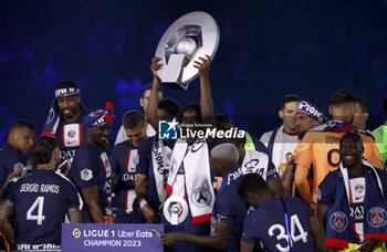 2023-06-03 - Danilo Pereira of PSG and teammates celebrate during the trophy ceremony following the French championship Ligue 1 football match between Paris Saint-Germain (PSG) and Clermont Foot 63 on June 3, 2023 at Parc des Princes stadium in Paris, France - FOOTBALL - FRENCH CHAMP - PARIS SG V CLERMONT - FRENCH LIGUE 1 - SOCCER