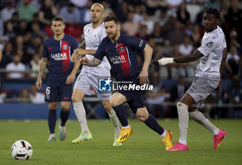 2023-06-03 - Lionel Messi of PSG between Johan Gastien and Muhammed Cham Saracevic of Clermont during the French championship Ligue 1 football match between Paris Saint-Germain (PSG) and Clermont Foot 63 on June 3, 2023 at Parc des Princes stadium in Paris, France - FOOTBALL - FRENCH CHAMP - PARIS SG V CLERMONT - FRENCH LIGUE 1 - SOCCER