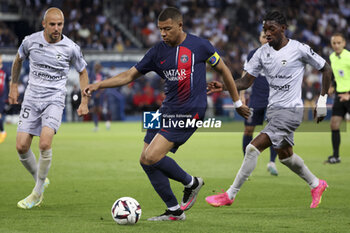 2023-06-03 - Kylian Mbappe of PSG between Johan Gastien and Muhammed Cham Saracevic of Clermont during the French championship Ligue 1 football match between Paris Saint-Germain (PSG) and Clermont Foot 63 on June 3, 2023 at Parc des Princes stadium in Paris, France - FOOTBALL - FRENCH CHAMP - PARIS SG V CLERMONT - FRENCH LIGUE 1 - SOCCER