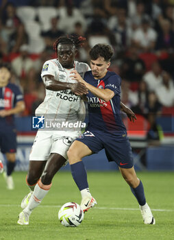 2023-08-13 - Bamo Meite of Lorient, Vitinha of PSG during the French championship Ligue 1 football match between Paris Saint-Germain (PSG) and FC Lorient on August 12, 2023 at Parc des Princes stadium in Paris, France - FOOTBALL - FRENCH CHAMP - PARIS SG V LORIENT - FRENCH LIGUE 1 - SOCCER