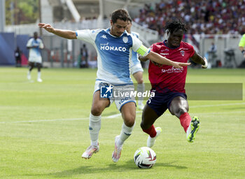 2023-08-14 - Wissam Ben Yedder of Monaco, Alidu Seidu of Clermont during the French championship Ligue 1 football match between Clermont Foot 63 and AS Monaco on August 13, 2023 at Gabriel-Montpied stadium in Clermont-Ferrand, France - FOOTBALL - FRENCH CHAMP - CLERMONT V MONACO - FRENCH LIGUE 1 - SOCCER