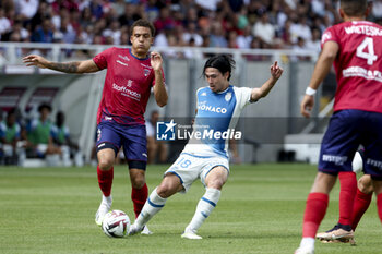 2023-08-14 - Takumi Minamino of Monaco (left) Neto Borges of Clermont during the French championship Ligue 1 football match between Clermont Foot 63 and AS Monaco on August 13, 2023 at Gabriel-Montpied stadium in Clermont-Ferrand, France - FOOTBALL - FRENCH CHAMP - CLERMONT V MONACO - FRENCH LIGUE 1 - SOCCER
